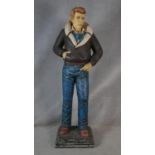 A painted life size figure of James Dean in fibreglass with copyright mark to the base. H.183cm