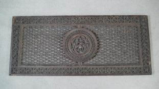 A 19th century heavy cast iron grille with intricate foliate central roundel and border. H.121 W.