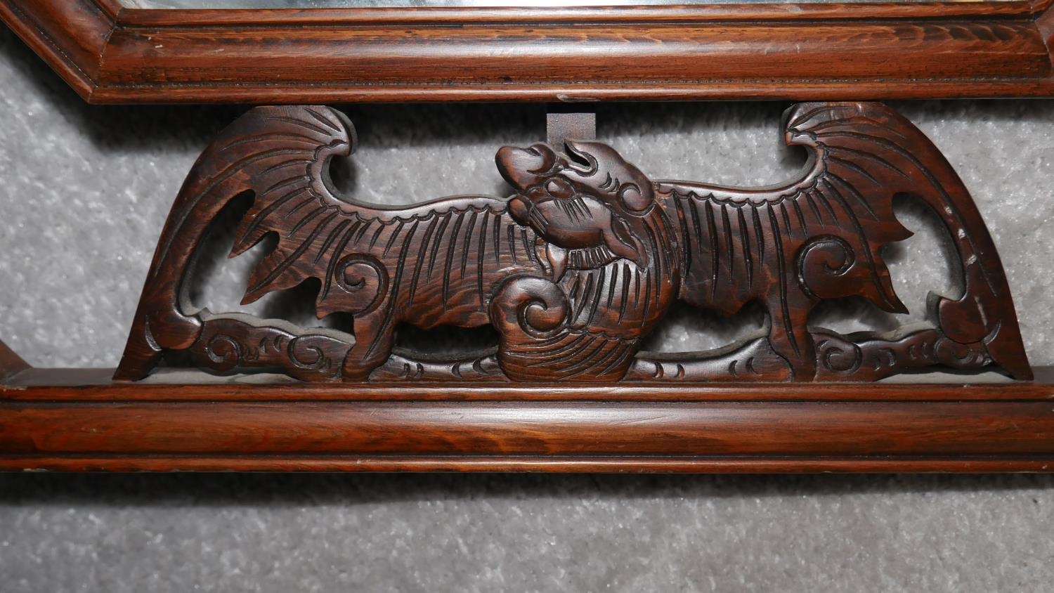 An Eastern teak bevelled plate wall mirror with Chinese bat carvings to the open fretwork frame. H. - Image 2 of 5