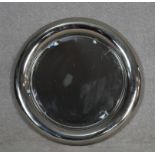A vintage chrome framed porthole style mirror with inset bevelled plate. D.68cm