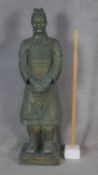 A large floor standing moulded figure of a terracotta warrior. H.116cm