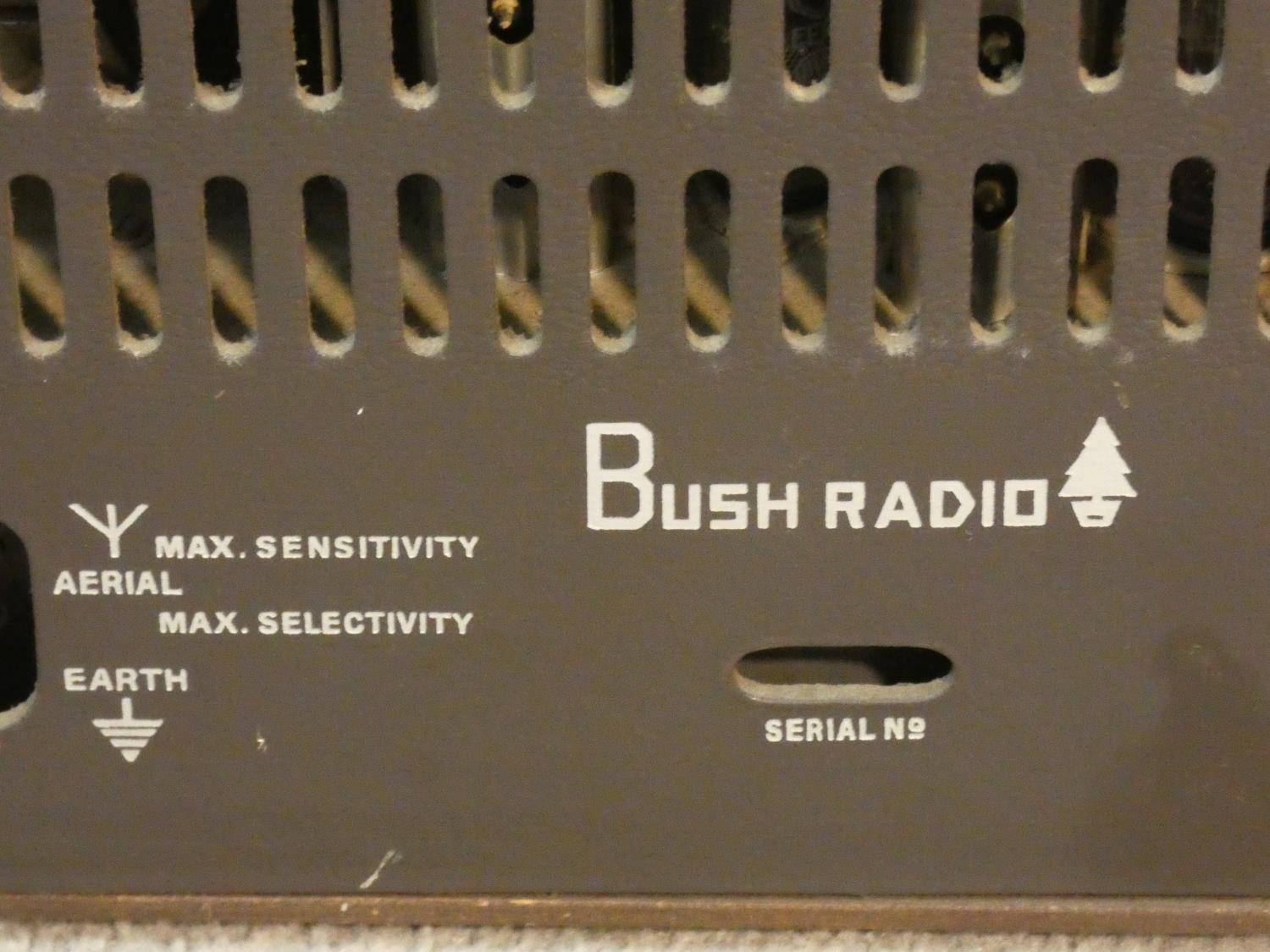 A vintage Bush walnut cased radio. With makers label. H.39 L.50 W.22cm - Image 9 of 9