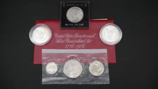 A collection of silver coins. Including a 1976 US uncirculated Silver proof Bicentennial 3 Coin Set,