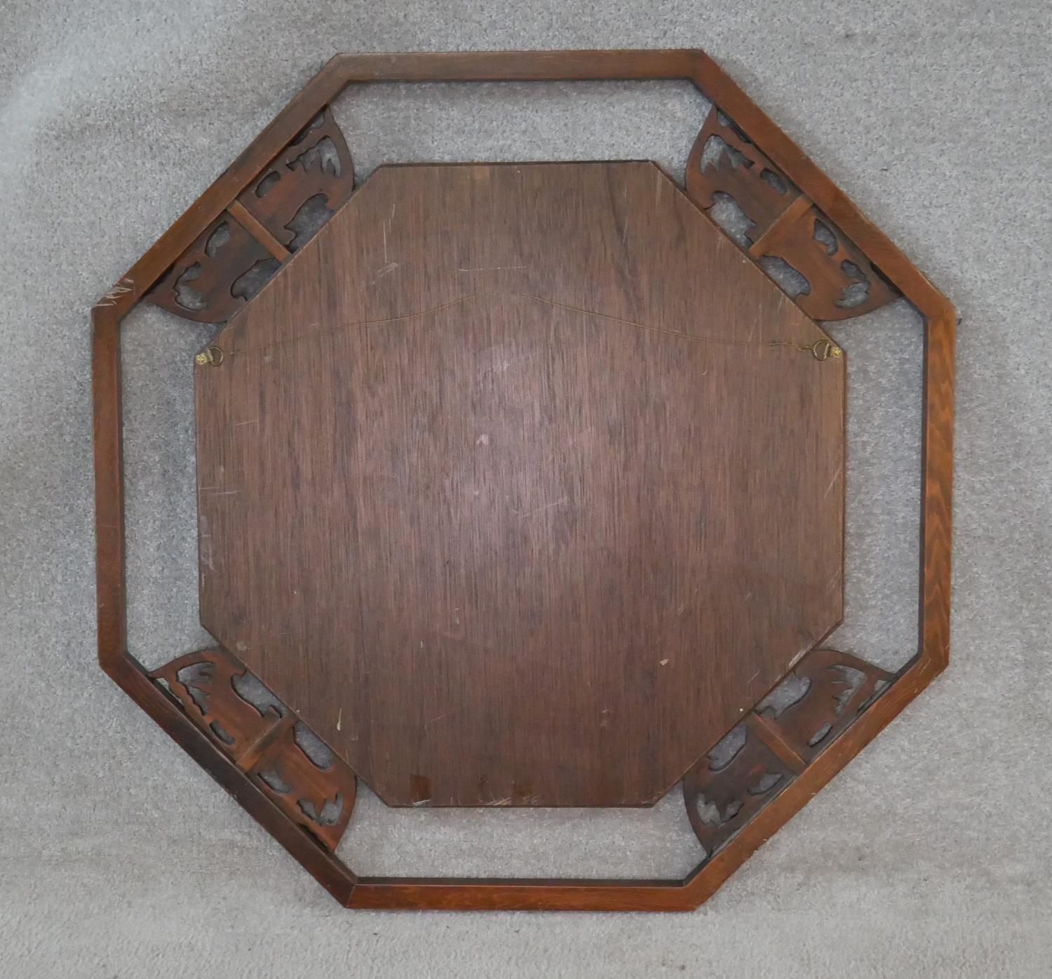 An Eastern teak bevelled plate wall mirror with Chinese bat carvings to the open fretwork frame. H. - Image 5 of 5