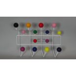 A mid century vintage atomic coat rack with full sphere multi-coloured ends. H.38 W.50cm
