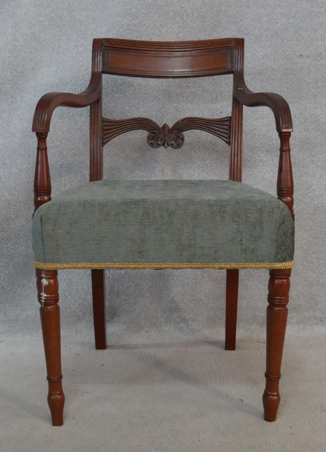 A Regency mahogany carved bar-back armchair on tapering ring turned supports. H.79cm