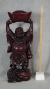 A large moulded resin lacquer effect laughing happy Buddha figure. H.94cm