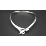 A contemporary Mexican silver cross over collar necklace with secure push catch. Stamped 925,