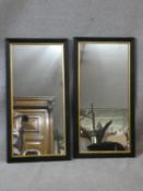 A pair of late 19th century style wall mirrors in moulded oak frames with gilt slips. H.79 W.40cm