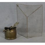 A 19th century brass coal bucket with tongs along with a brass folding mesh fire guard. H.75 W.61cm
