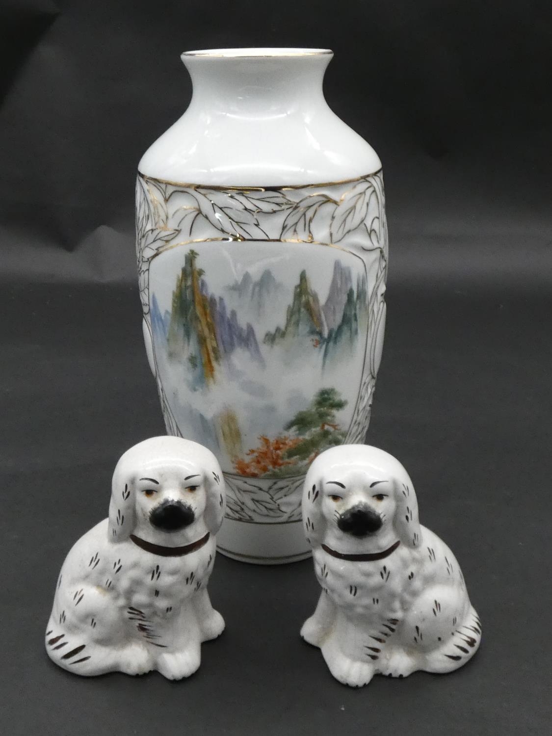 A pair of 19th century Staffordshire style dogs and a painted and glazed Japanese vase. H.25cm