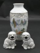 A pair of 19th century Staffordshire style dogs and a painted and glazed Japanese vase. H.25cm