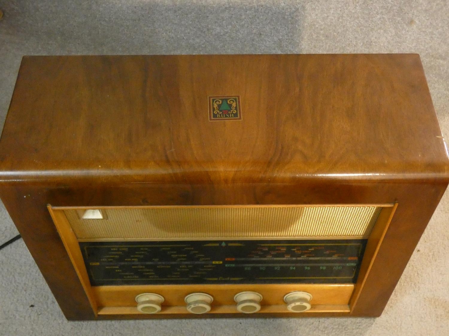 A vintage Bush walnut cased radio. With makers label. H.39 L.50 W.22cm - Image 7 of 9