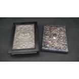 Two leather silver fronted note books, one with repousse floral decoration hallmarked: JBLd for John