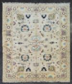 A fine Ziegler style carpet with repeating lotus flower, palmette and serrated palm decoration on