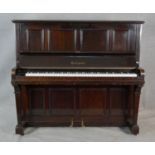 A Boyd of London mahogany cased upright piano with maker's mark to the iron frame. H.131.5 W.148 D.