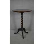 A 19th century walnut occasional table with satinwood and olivewood floral inlay raised on spiral