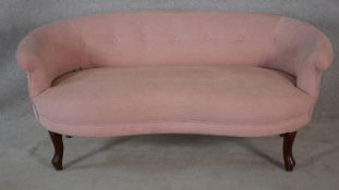 A French style two seater canape in blush buttoned velour upholstery on cabriole supports. H.64 W.
