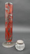 An Art Nouveau cranberry glass flower vase both top and bottom are edged in sterling silver and