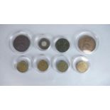 Eight coins. Including a Victorian one penny model coin, four three pence coins, dated 1941, 42,