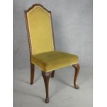 A mid century carved walnut framed early Georgian style side chair on cabriole pad feet supports.
