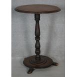 A Victorian mahogany lamp table on turned pedestal platform base. H.72 D.52cm
