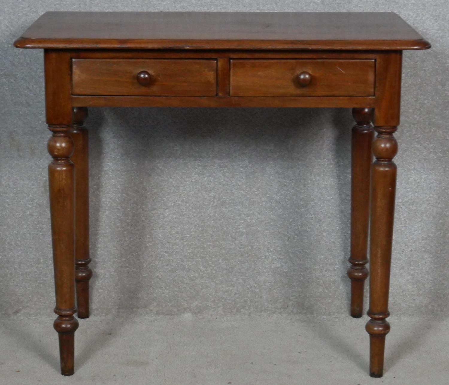 A 19th century mahogany hall table with frieze drawers on turned tapering supports. H.73 W.83.5 D.