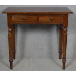 A 19th century mahogany hall table with frieze drawers on turned tapering supports. H.73 W.83.5 D.