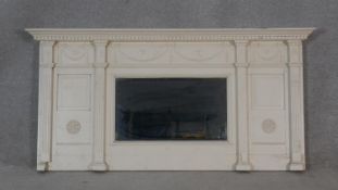 A 19th century Adam style overmantel mirror with dentil cornice with swag decoration above central