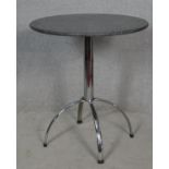 A polished stone topped occasional table on chrome space age quadruped supports. H.77 D.69cm