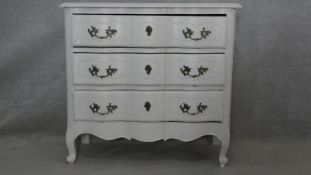 A painted French Provincial style chest of drawers on carved cabriole supports. H.84 W.90 D.43cm