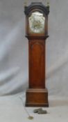 A Georgian mahogany cased longcase clock with urn form brass finials, the eight day movement by