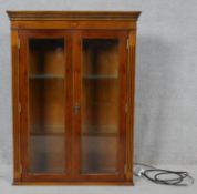 A Georgian style inlaid yew wood bookcase section fitted with interior light. H.99.5 W.74 D.27cm