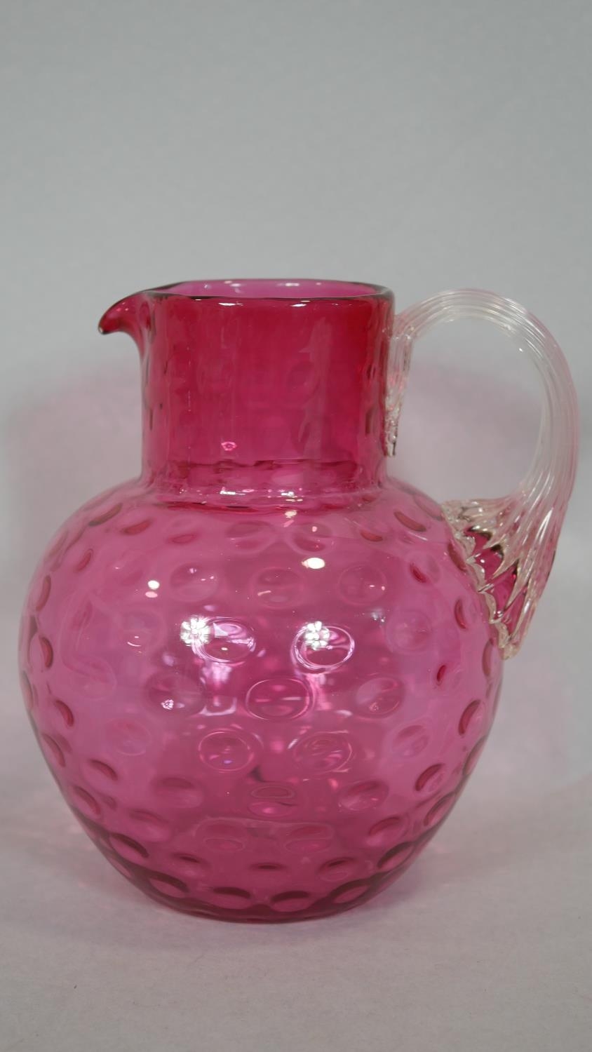 A Victorian cranberry glass jug, a stoneware flagon and two other milk jugs. H.34cm (Tallest) - Image 13 of 15