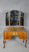 A mid century Queen Anne style walnut dressing table. H.171 W.103 D.49cm