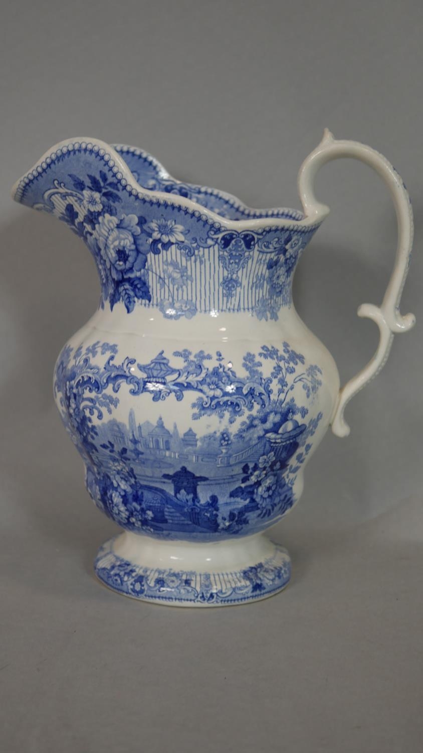 A Victorian cranberry glass jug, a stoneware flagon and two other milk jugs. H.34cm (Tallest) - Image 8 of 15