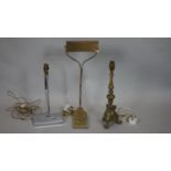 A vintage brass banker's desk lamp on scroll base, an Art Deco lamp base and a brass ecclesiastic