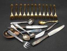 A collection of as new various patterns of Christofle, Paris cutlery. Includes twelve gilded