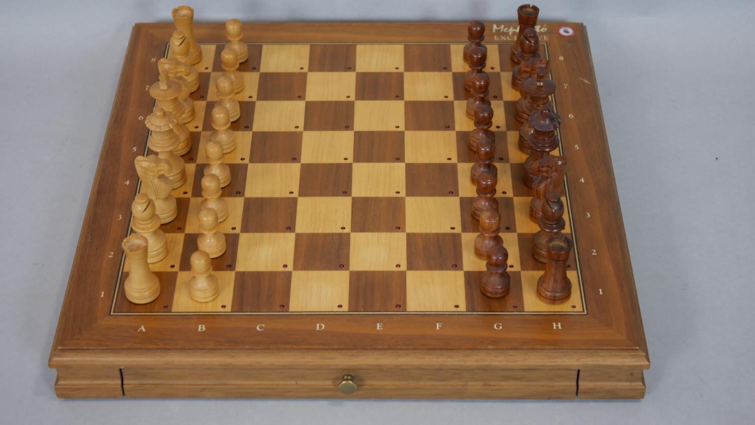 A 1980's Mephisto Exclusive hardwood modular chess board with pieces. (Complete) H.5 L.41 W.40.5cm