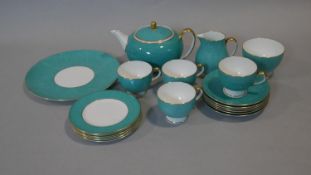 A part six person Wedgwood tea service. The set has a dappled turquoise and gilt design. Makers