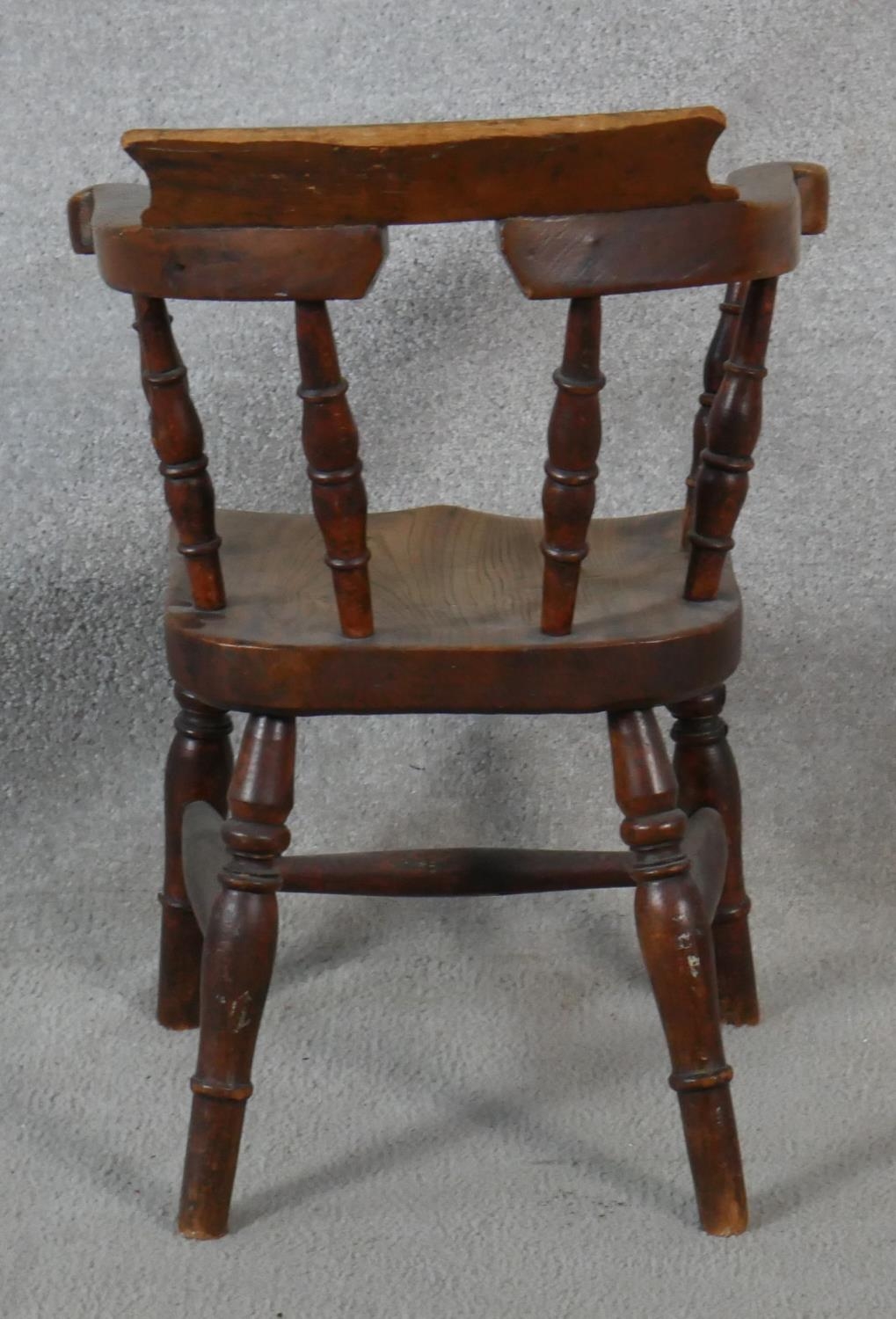 A 19th century elm child's stick back armchair with moulded seat above turned stretchered - Image 3 of 3