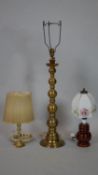 A tall brass table lamp base along with a smaller example with shade and a vintage brown glazed