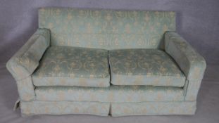 A floral upholstered two seater sofa. L.182.D94.H.80cm