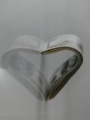 A photographic print on acrylic by Israeli artist Boaz Aharonovitch, heart made from dollar notes.