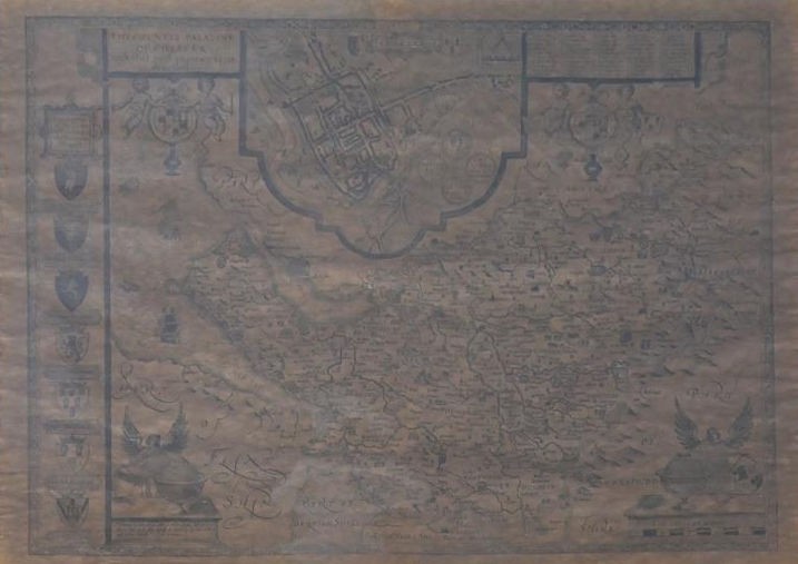 A framed and glazed 19th century map of the County of Chester. With scale bar and armorial crest