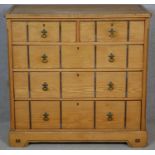 A late Victorian Aesthetic movement pitch pine chest of drawers with ebony and satinwood inlay and