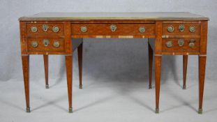 A 19th century Louis XVI style writing table in the manner of Donald Ross with leather lined and