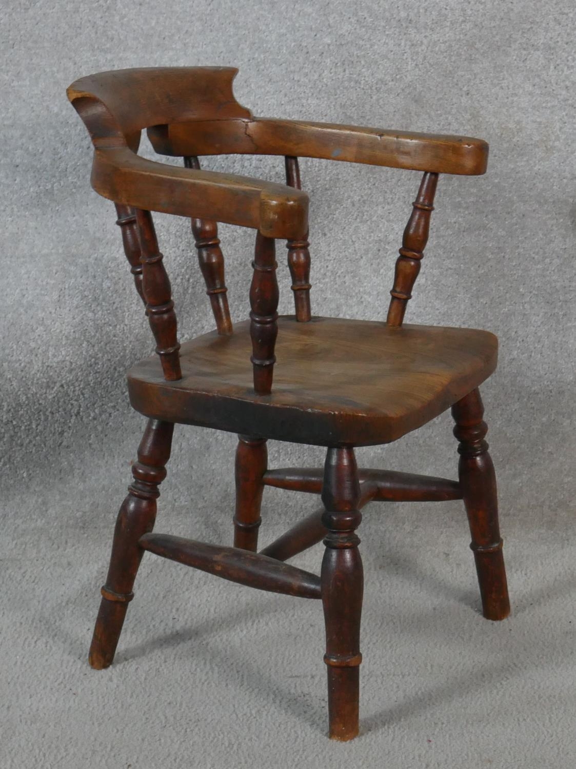 A 19th century elm child's stick back armchair with moulded seat above turned stretchered - Image 2 of 3