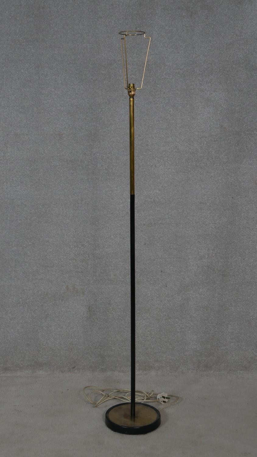 A vintage brass and tubular metal standard lamp. H.145cm