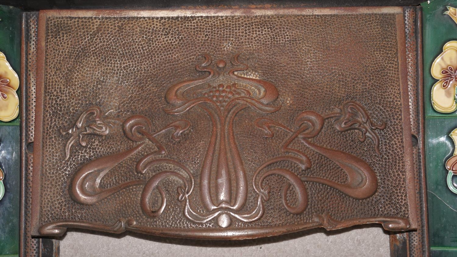 A late 19th century cast iron fire insert with stylised Art Nouveau ceramic tiled lilies flanking - Image 2 of 10